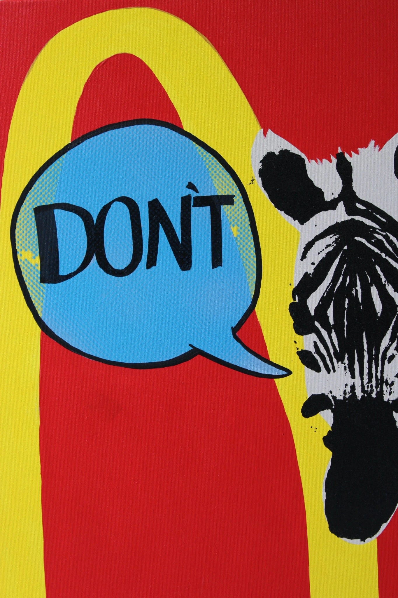 "Close-up view of the zebra in 'DON'T' by Let Z Be Studio, emphasizing the black and white stripes and the vibrant blue speech bubble."
