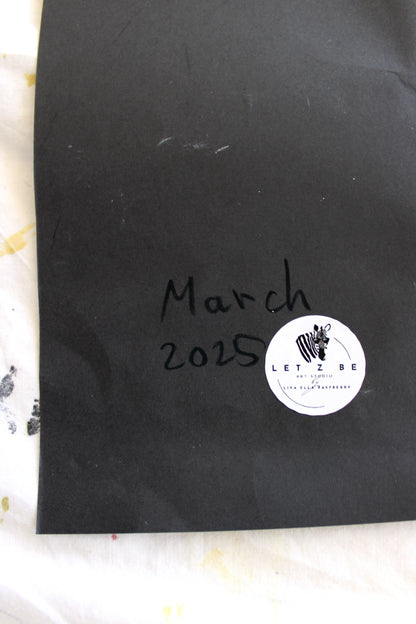 "Close-up image of the back of a black paper, featuring the artist’s signature, a 'March 2025' date, and a 'Let Z Be' logo sticker, symbolizing the authenticity of the artwork."