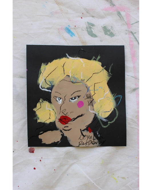 "Expressive self-portrait painted with acrylic, pastel, and charcoal on black paper. Features intense gaze, pink cheek, and bold facial lines."

