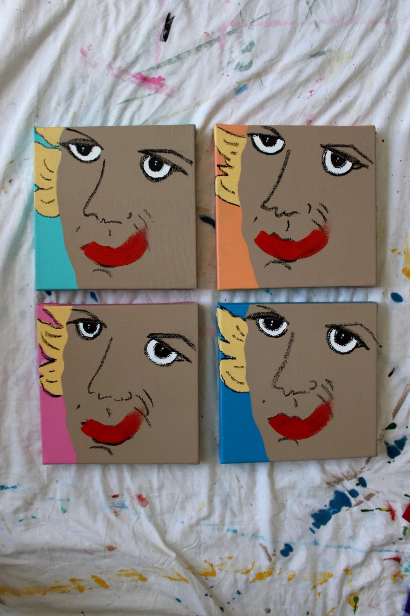 "Pop art portrait series 'Fake or Real' by Liya Ella Raspberry for Let Z Be – four acrylic paintings exploring identity through exaggerated smiles on canvas."