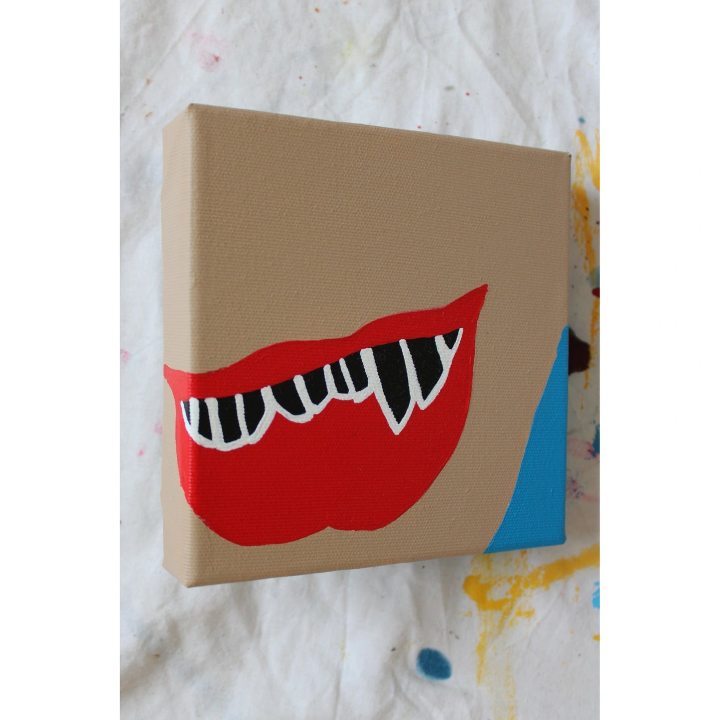 Angled view of "Play Me, Boy. Mouth No.4" by Liya Ella Raspberry – acrylic pop art painting from the PLAY ME, BOY. series, featured in Let Z Be’s ZINE, June 2025.
