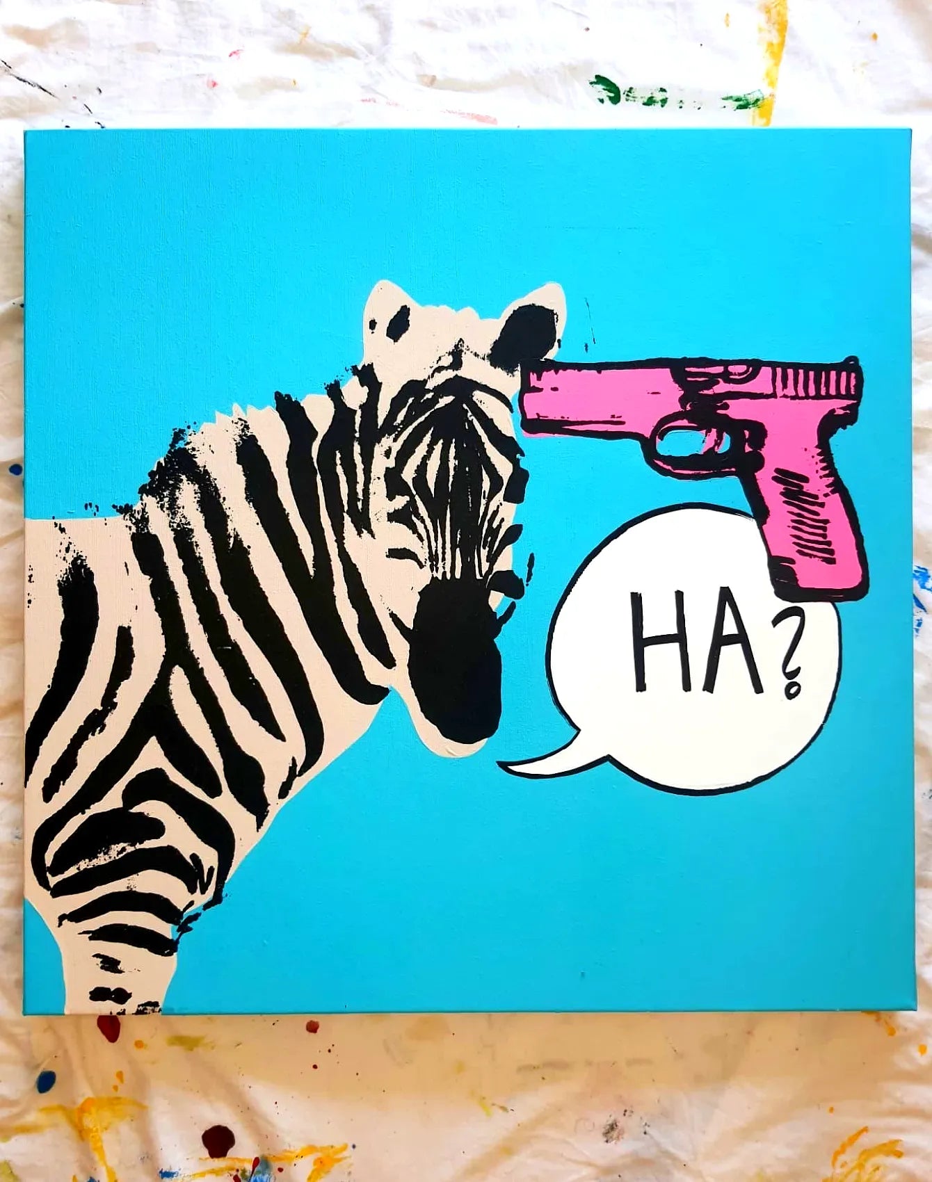 A zebra with a gun attached to its head